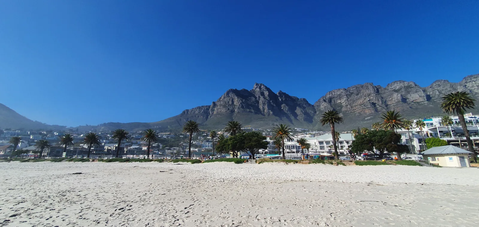 Camps Bay Beach beneath the Twelve Apostles mountain range in Cape Town