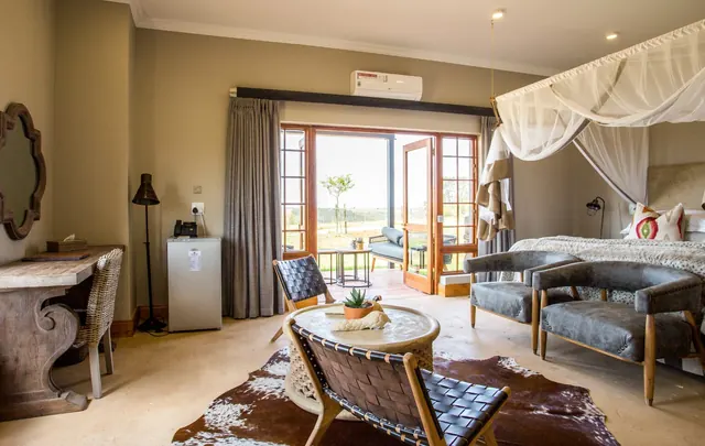 Village Lodge family room bedroom at Botlierskop