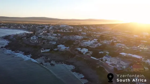 Yzerfontein village and rocky Cape West Coast shoreline at sunset