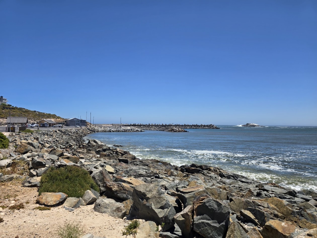 Yzerfontein harbour with rugged coastal rocks and Atlantic Ocean
